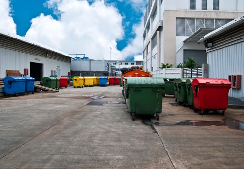 Waste materials being loaded into a commercial skip